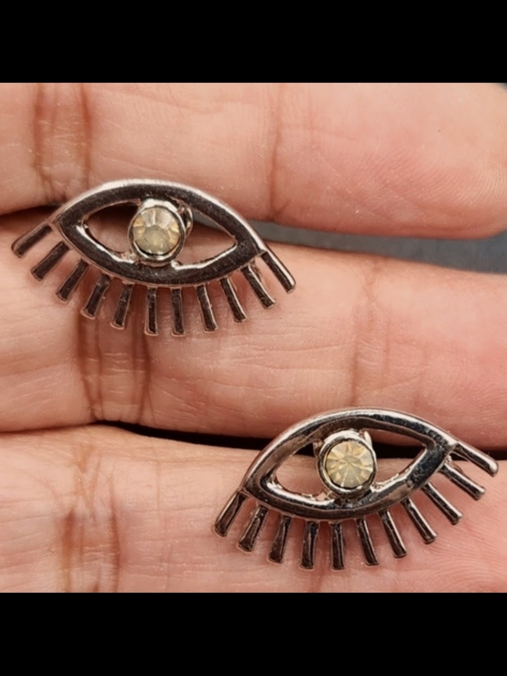 Silver Eye-Shaped Stud Earrings with Champagne Stone